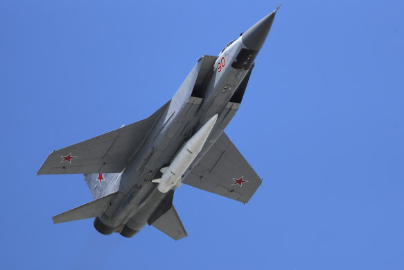 A Russian Air Force MiG-31K jet carries a high-precision hypersonic aero-ballistic missile Kh-47M2 Kinzhal on a Victory Day military parade in 2018.