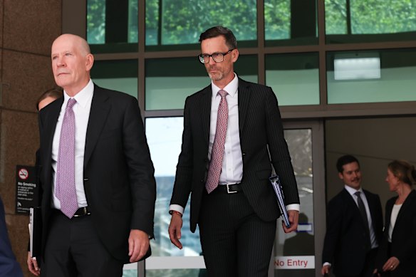 Chris Young, KC, (centre) leaves Melbourne Magistrates’ Court after the Big Build royal commission’s first hearing on Wednesday.