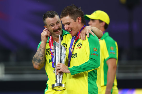 Matthew Wade and Adam Zampa with the Twenty20 World Cup. 