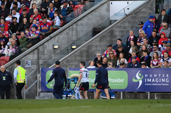 Luke Keary comes from the field after being caught by the boot of Dominic Young.