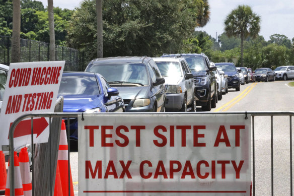 COVID-19 testing reaches capacity, as cars wait in line in Orlando, Florida. 