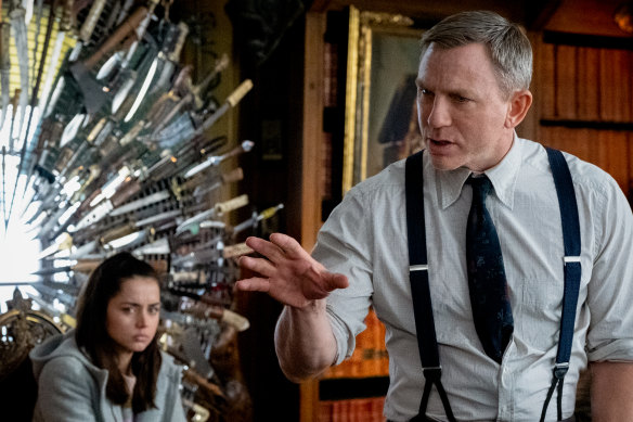 Ana de Armas as Marta Cabrera and Daniel Craig as Benoit Blanc.