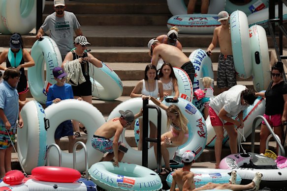 Tubers prepare to float the Comal River in Texas despite the recent spike in COVID-19 cases.