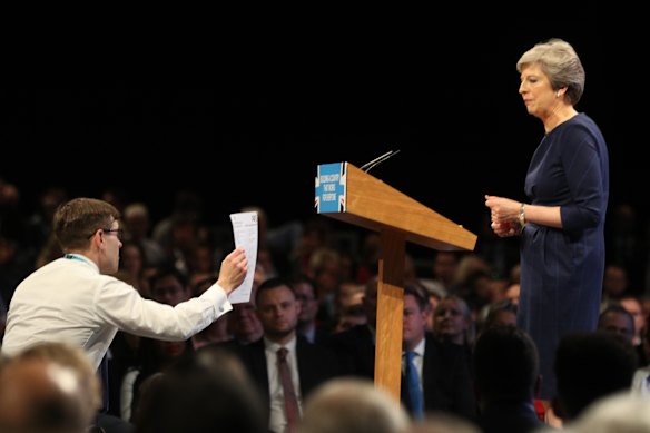Simon Brodkin hands Theresa May her marching orders during the Conservative Party Conference in 2017.