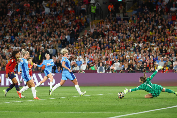 Spain’s Olga Carmona (partly obscured) scores the only goal of the final.