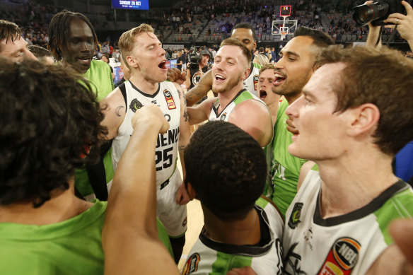 Phoenix players celebrate their winning start in the league.