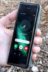 Closed up in 'phone' mode, Samsung's Galaxy Fold is a little taller than other phones, but much thinner and easier to grip.