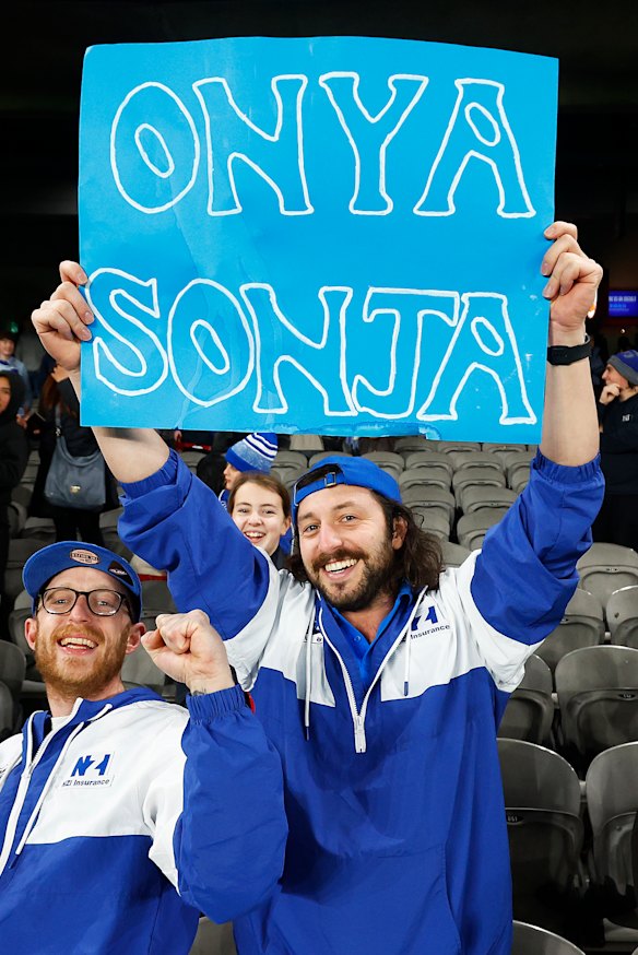 Kangaroos fans hold a sign in support of club president Sonja Hood.