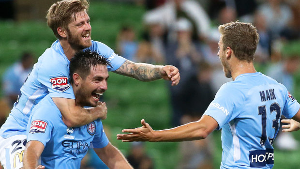Home in a canter: Stefan Mauk of Melbourne City celebrates his goal with provider, Bruno Fornaroli.