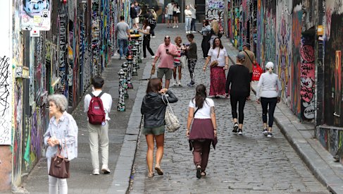 Nature is healing with tourists back taking photos of graffiti in Hosier Lane. 