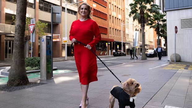 Gina Edwards and Oscar the cavoodle outside court before the judgment.