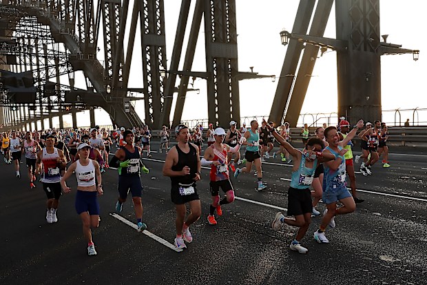 Competitors run across the Sydney Harbour Bridge during the 2026 TCS Sydney Marathon on August 30, 2026 in Sydney, Australia.
