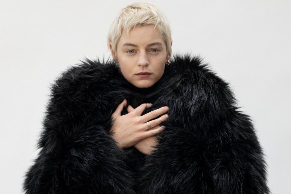 Corrin wears faux-fur coat by Anthony Vaccarello for Saint Laurent, and Trinity earrings and ring by Cartier.