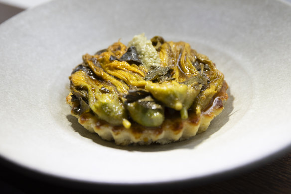 Braised zucchini flowers with warm ricotta.