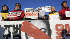 Protesters stage a rally to demand South Korean President Yoon Suk Yeol to step down in front of the National Assembly in Seoul, South Korea, Wednesday, Dec. 4, 2024. The signs read “Punish.”