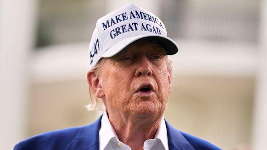 Donald Trump speaks as a flag pole is installed on the South Lawn of the White House overnight.