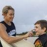 Emma Le Sueur, from The Fit Way at Lennox Head, applying sunscreen lotion on her son, Jaxon, aged 8. 