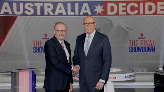 Albanese and Dutton shake hands ahead of the final leaders’ debate on Sunday evening.
