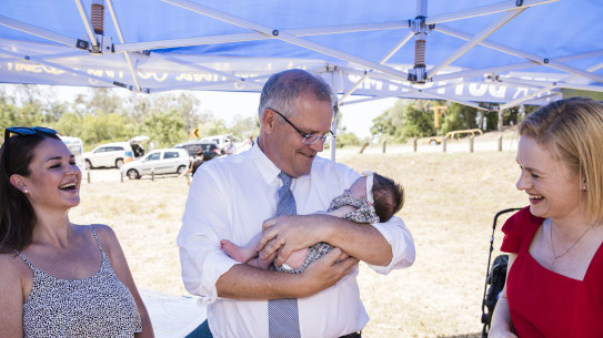 The Prime Minister Scott Morrison and Senator Amanda Stoker on the husting during the 2019 election. 
