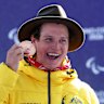 Bronze medallist Ben Tudhope of Team Australia celebrates on the podium during the medal ceremony for the Para Snowboard Men’s Banked Slalom SB-LL2.