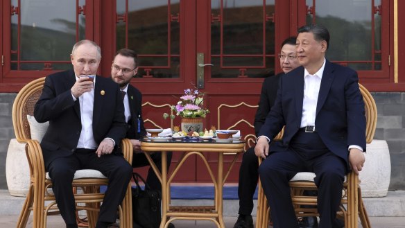 Russian President Vladimir Putin, and Chinese President Xi Jinping attend an informal meeting in Beijing, China.