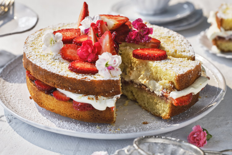 Decorate the cake with strawberries and/or edible flowers.