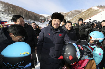 Chinese President Xi Jinping meets children attending ski camps while inspecting early preparations for the Beijing 2022 Winter Olympic Games. 