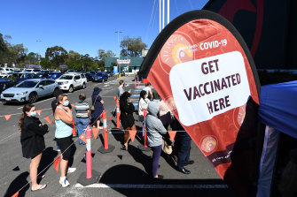 People queuing to get a COVID-19 vaccine at a Bunnings clinic.
