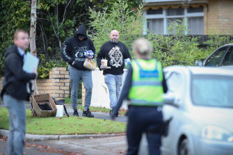 Men visit Mr Reker’s property which was the target of a drive-by shooting in 2018.