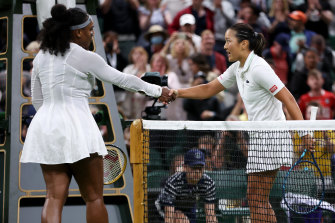 Serena Williams co<em></em>ngratulates a shocked Harmony Tan.