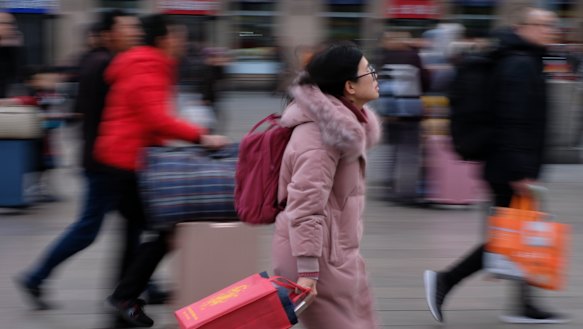 Passengers rush to Beijing Railway Station, many heading home for Spring Festival.