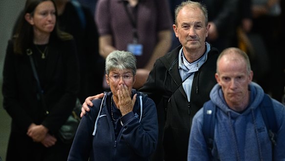A woman becomes emotion inside the historic hall.