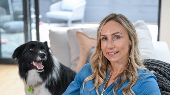 Whitney Sloan (pictured with her dog Tux) says she still considers her ex-husband “a great man and a great father”.