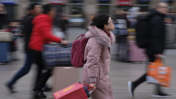 Passengers rush to Beijing Railway Station, many heading home for Spring Festival.