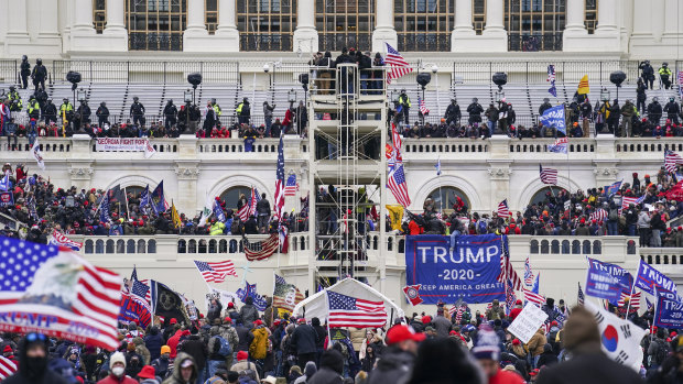 Insurrectionists loyal to Donald Trump violently attack the US Capitol in an effort to overturn the election results on January 6, 2021.