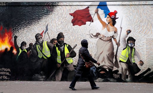 A mural in Paris by street artist PBOY depicting yellow vest protesters. It's inspired by Eugene Delacroix's 'La Liberte guidant le peuple' (Liberty Leading the People) – one of the most famous French paintings ever, which is housed in the Louvre.