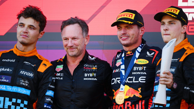 Lando Norris (left) and teammate Oscar Piastri (right) with Red Bull team principal Christian Horner and Japanese F1 Grand Prix winner Max Verstappen.