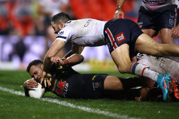 Api Koroisau dives over for a second-half try to seal the Panthers’ win over the Roosters.
