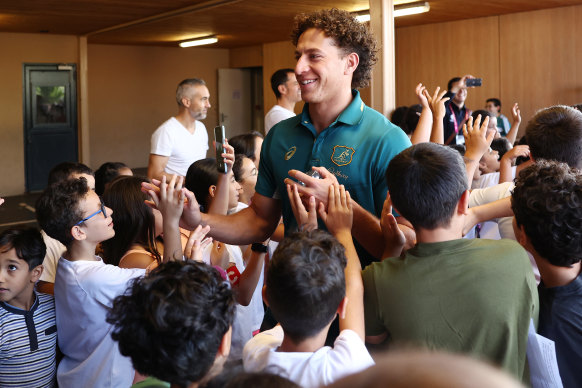 Wallabies winger Mark Nawaqanitawase at a school visit in Saint-Etienne on Monday. 