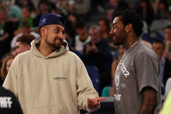 Nick Kyrgios at an NBL basketball game in Melbourne at the weekend talking to John Wall.