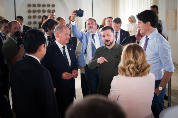 German Chancellor Olaf Scholz and Canadian PM Justin Trudeau listen to Zelensky in Fasano, Italy, during the G7 summit.