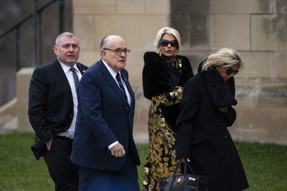  Lev Parnas, left, with Rudy Giuliani, second from left, arriving before a state funeral service for former US president George H.W. Bush in 2018.