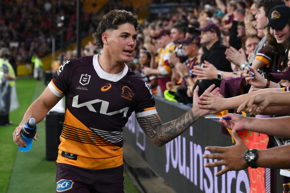 Reece Walsh celebrates with fans after helping to lead the Broncos to a 26-0 victory.