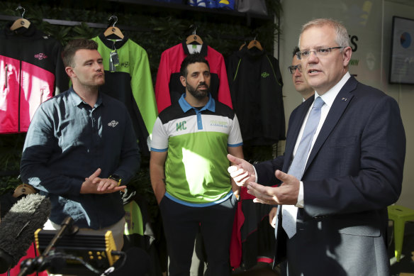 Canberra A-League bid leader Michael Caggiano (middle) with Prime Minister Scott Morrison back in 2018.