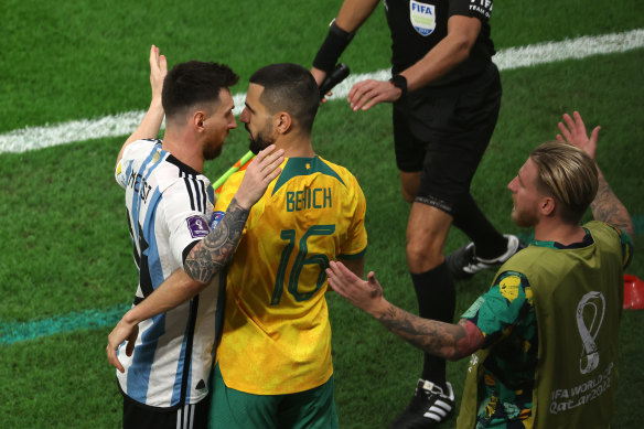 Messi tussles with Aziz Behich.