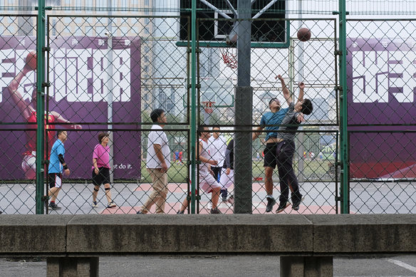 Chinese basketball fans playing at Dongdan Basketball Park in central Beijing.