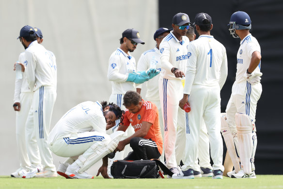 KL Rahul of India receives medical treatment after being struck on his right arm from a delivery by Prasidh Krishna on Friday. 