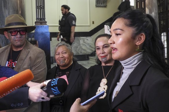 Hana-Rawhiti Maipi-Clarke (right) and her colleagues from Te Haiti Māori talk to reporters after the protest inside parliament.