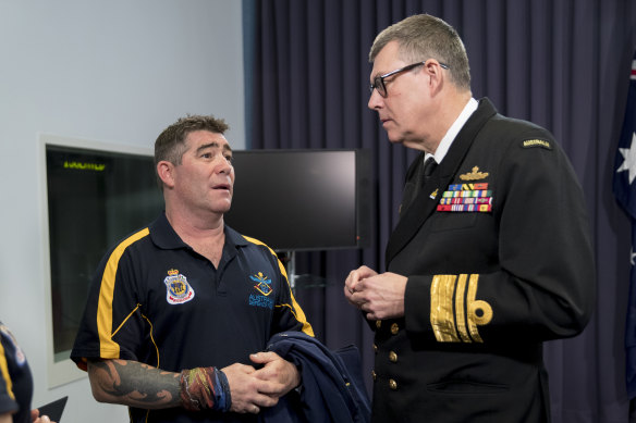 Sergeant Peter Rudland (left) speaks with Vice Admiral Ray Griggs in 2017. Rudland was co-captain of the Australian team at the Invictus Games.