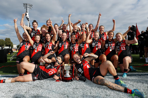 Essendon celebrate the VFLW premiership.
